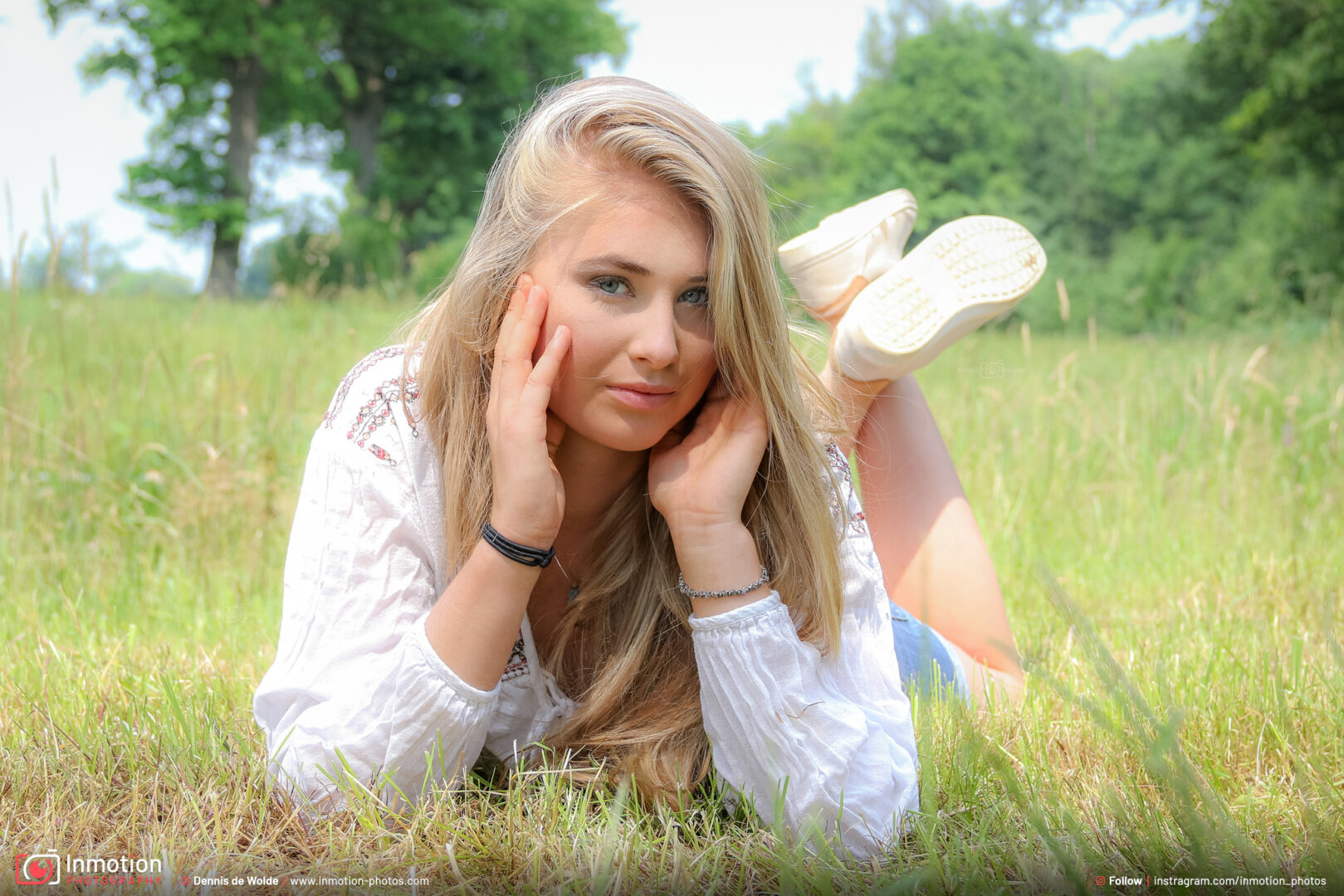 Photoshoot Gaby Lying In Grass White Dress Smiling